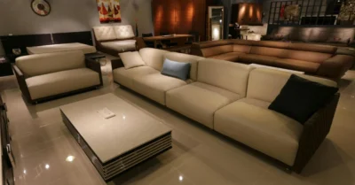 Interior of a large furniture retail store in Abu Dhabi featuring modern living room setups