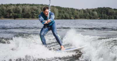 A man wakeboarding in a lake