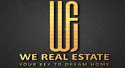 WE REAL ESTATE logo image