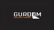 Guroom Holiday Homes logo image Guroom Holiday Homes logo image