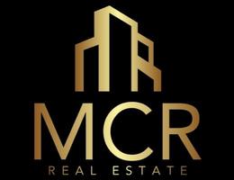 M C R REAL ESTATE