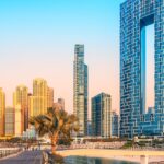 Beautiful architecture rising against the skyline along the jumeirah beach of dubai during sunset