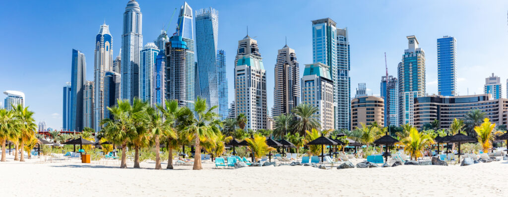 Dubai Marina skyline with modern high-rise towers and beachfront, symbolizing prime opportunities in off-plan real estate sales.