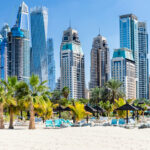 Dubai Marina skyline with modern high-rise towers and beachfront, symbolizing prime opportunities in off-plan real estate sales.