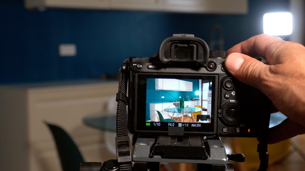 Real estate photographer takes photos and video inside house with professional camera and drone - technology to sell home - real estate agency and photograph shooting - home staging