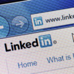Close-up of LinkedIn website in a browser, representing professional networking and marketing strategies for real estate agency owners.