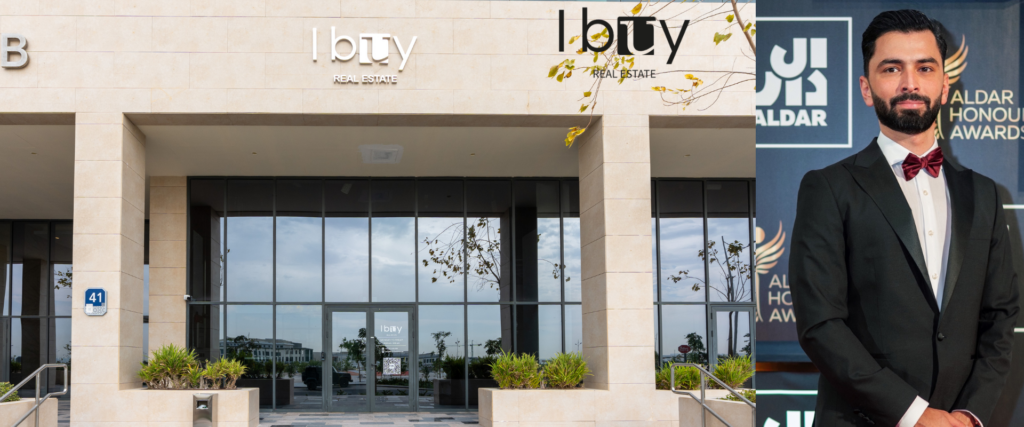 Exterior of I Buy Real Estate office in Dubai alongside portrait of Alan Harthy, Founder & CEO, at the Aldar Honours Awards.