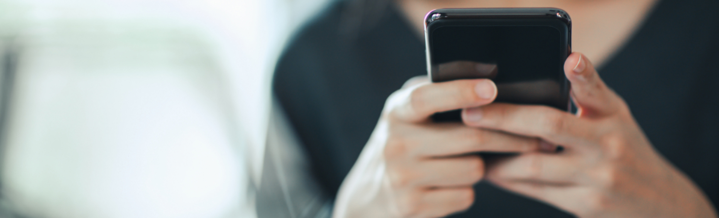 Close-up of hands using a smartphone for WhatsApp messaging—UAE real estate agents running compliant broadcasts with segmentation, approved templates, and CRM logging to boost lead conversion.