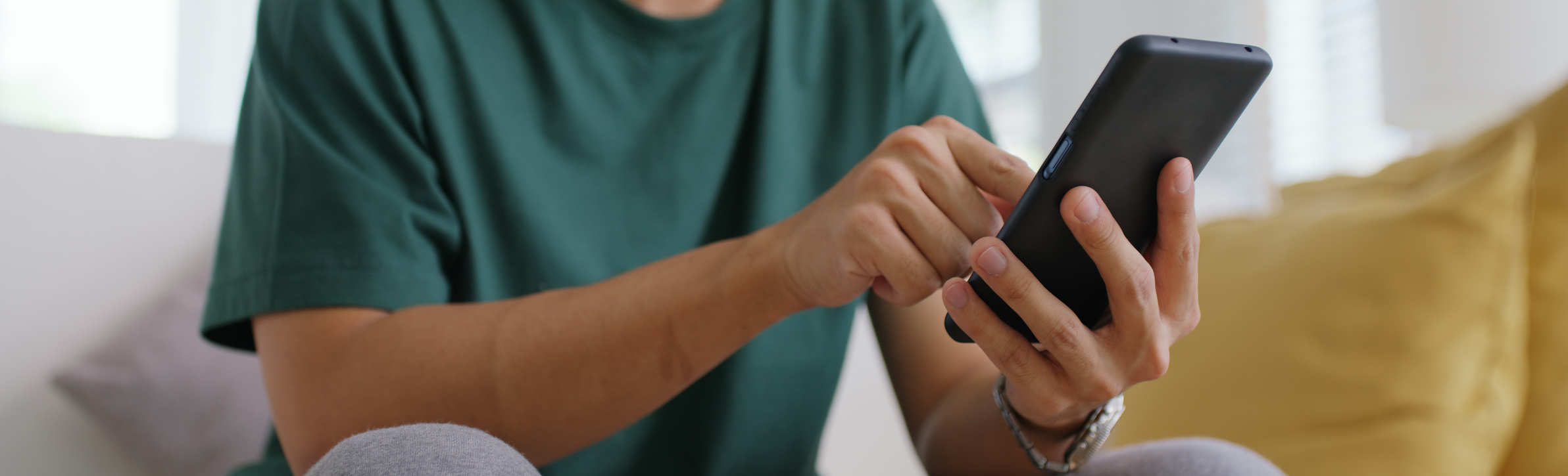 Close-up of a person using a smartphone for WhatsApp messaging, representing how UAE real estate agents engage buyers through mobile-first communication channels to increase lead conversion, response speed, and viewing bookings.