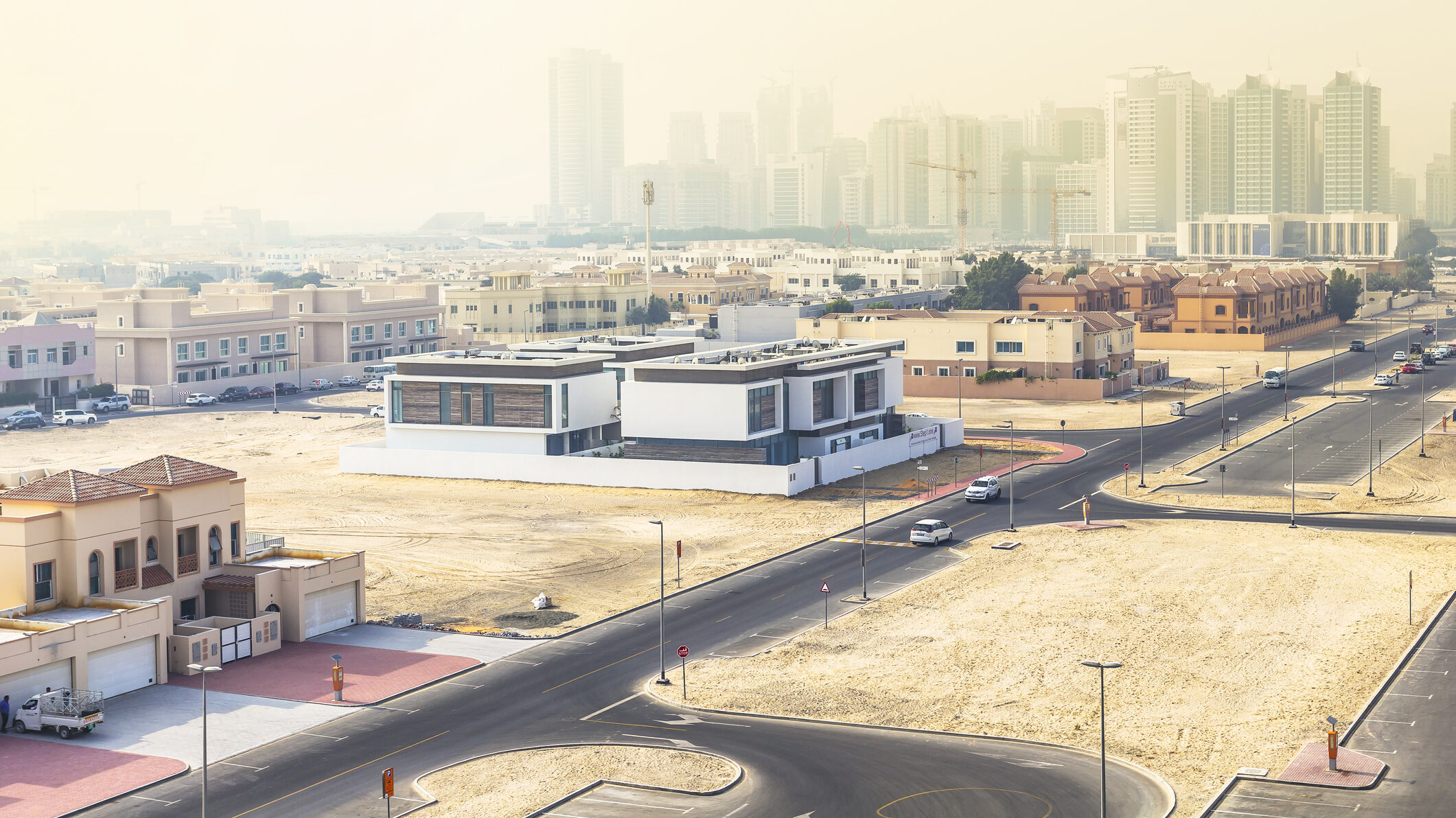 Dubai residential development area under construction with new roads and villas, illustrating regulatory compliance and planning in off-plan real estate projects