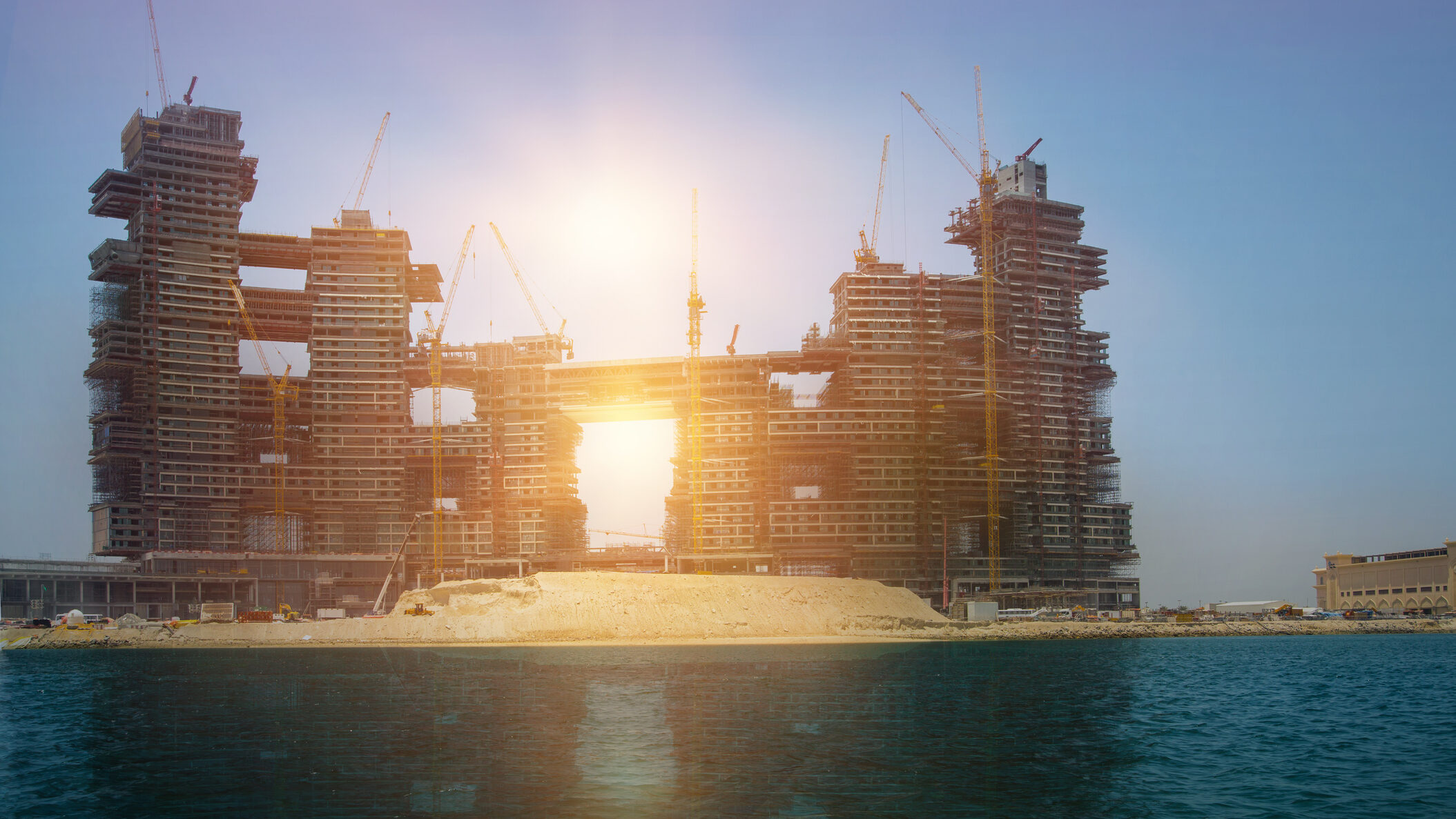 Off-plan waterfront real estate development in Dubai under construction, illustrating Oqood registration, escrow-linked construction progress, and buyer protection in off-plan property sales.