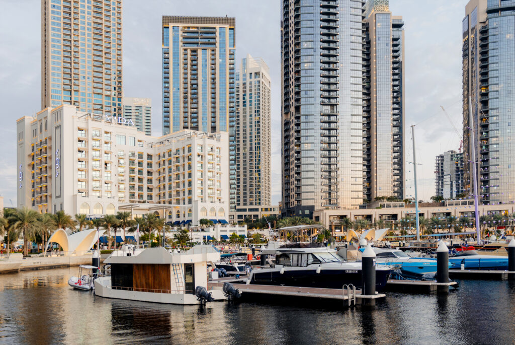Dubai Creek Harbour skyline with modern waterfront residential towers, marina yachts, and mixed-use developments, highlighting contemporary urban living and sustainable real estate growth in Dubai.