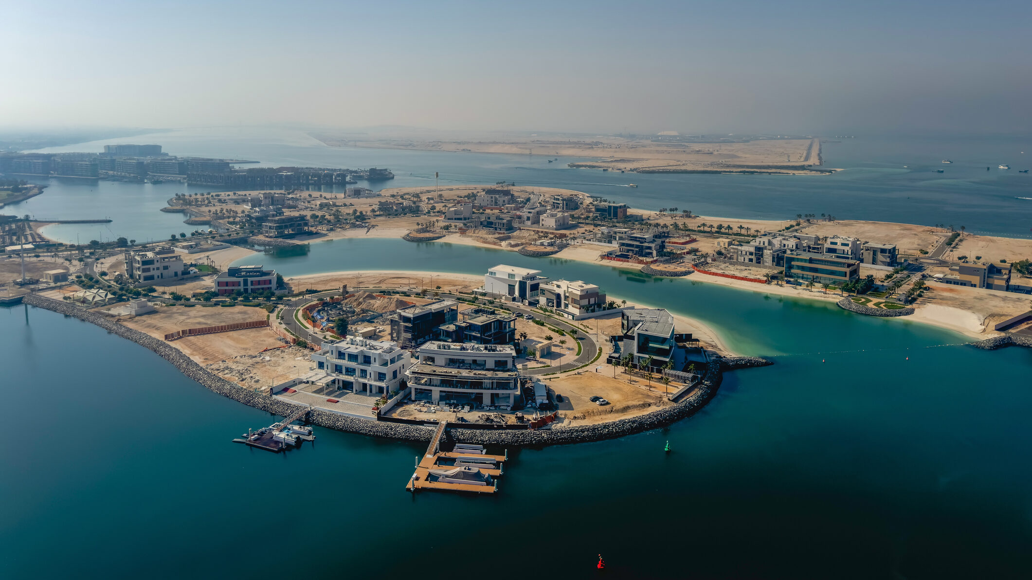 Aerial view of Dubai waterfront community and villas, showing a micro-market neighbourhood for UAE real estate agents to specialise in and build consistent listing supply