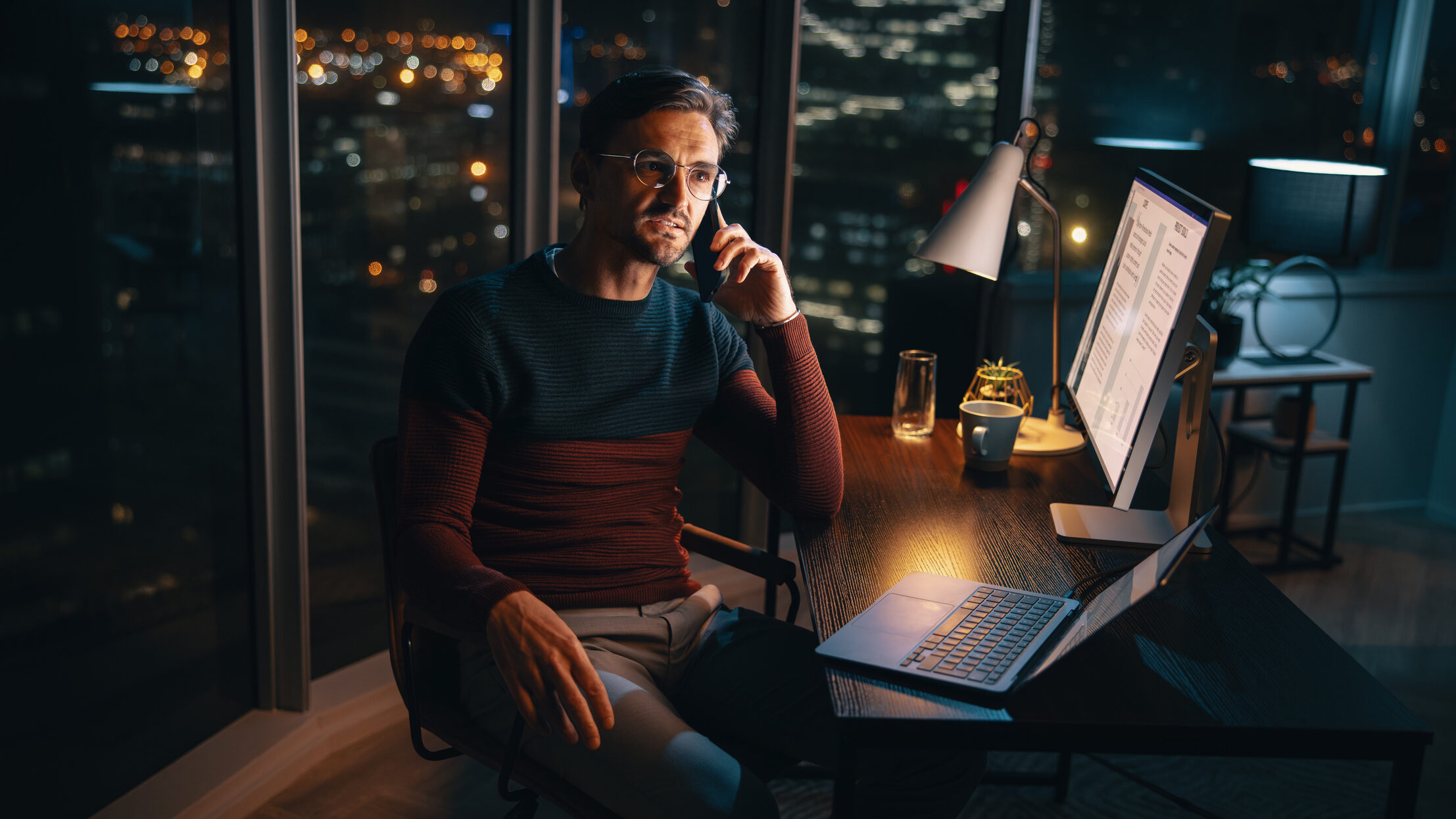 Real estate agent working late and responding to client communication, reflecting the need for healthy boundaries and structured follow-up.