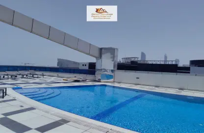 صورة لـ حوض سباحة شقة - 2 غرف نوم - 3 حمامات للايجار في برج درويش - دانة بو ظبي - أبوظبي ، صورة رقم 1
