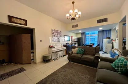 Living Room image for: Apartment - 2 Bedrooms - 2 Bathrooms for sale in Glitz 3 - Glitz - Dubai Studio City - Dubai, Image 1