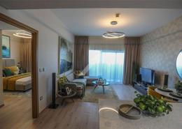 صورةغرفة المعيشة لـ: شقة - 1 غرفة نوم - 2 حمامات للبيع في عزيزي اورا - جبل علي داون تاون - دبي, صورة 1