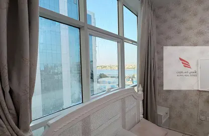 شقة - غرفة نوم - 2 حمامات للايجار في أورينت تاور 1 - أورينت تاور - البستان - عجمان