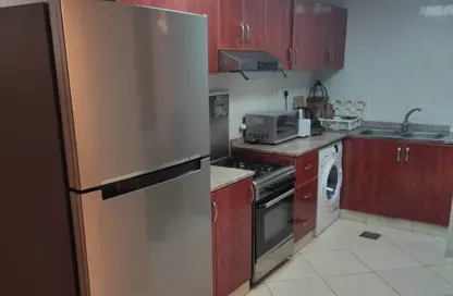 شقة - غرفة نوم - 2 حمامات للبيع في أورينت تاور 1 - أورينت تاور - البستان - عجمان