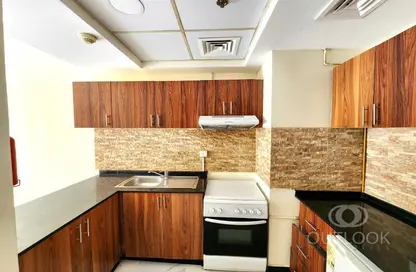 صورة لـ مطبخ شقة - غرفة نوم - 1 حمام للايجار في كنسينجتون مانور - قرية الجميرا سركل - دبي ، صورة رقم 1