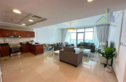 Living / Dining Room image for: Apartment - 1 Bedroom - 2 Bathrooms for rent in Ajman Corniche Residences - Ajman Corniche Road - Ajman, Image 1