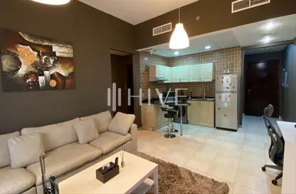 Living / Dining Room image for: Apartment - 1 Bedroom - 2 Bathrooms for rent in Hamza Tower - Dubai Sports City - Dubai, Image 1