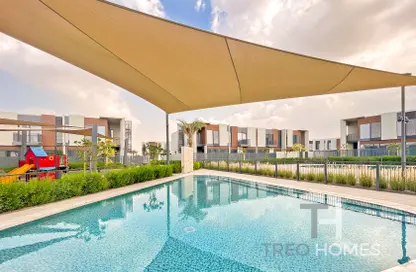 Pool image for: Townhouse - 3 Bedrooms - 4 Bathrooms for sale in Cherrywoods - Dubai Land - Dubai, Image 1