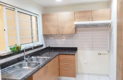 صورة لـ مطبخ شقة - 3 غرف نوم - 4 حمامات للبيع في مساكن الفرجان - القرية الجنوبية - الفرجان - دبي ، صورة رقم 1