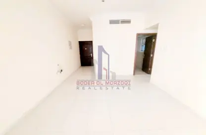 Empty Room image for: Apartment - 1 Bedroom - 1 Bathroom for rent in Lily Tower - Al Nahda - Sharjah, Image 1