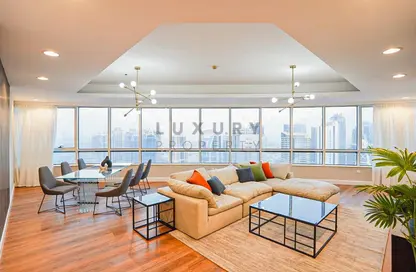 Living / Dining Room image for: Apartment - 4 Bedrooms - 4 Bathrooms for rent in Horizon Tower - Dubai Marina - Dubai, Image 1