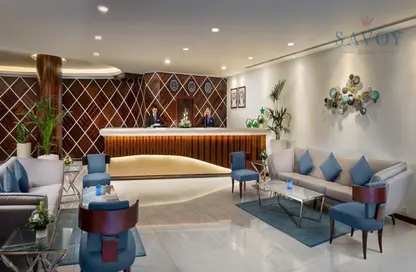 صورة لـ غرفة المعيشة النزل و الشقق الفندقية - 1 حمام للايجار في سافوي سويتس للشقق الفندقية - منخول - بر دبي - دبي ، صورة رقم 1