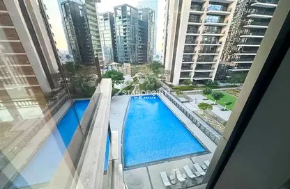Pool image for: Apartment - 1 Bedroom - 2 Bathrooms for sale in Boulevard Crescent 2 - BLVD Crescent - Downtown Dubai - Dubai, Image 1