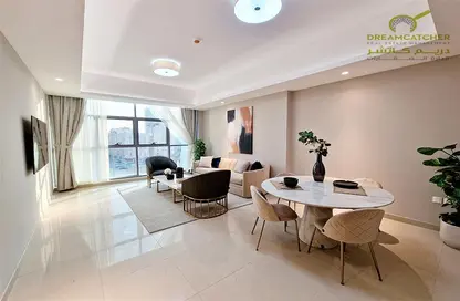 Living / Dining Room image for: Apartment - 1 Bedroom - 2 Bathrooms for sale in Gulfa Towers - Al Rashidiya 1 - Al Rashidiya - Ajman, Image 1