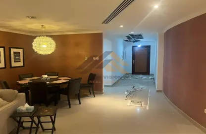 Dining Room image for: Apartment - 2 Bedrooms - 3 Bathrooms for sale in Corniche Tower - Ajman Corniche Road - Ajman, Image 1