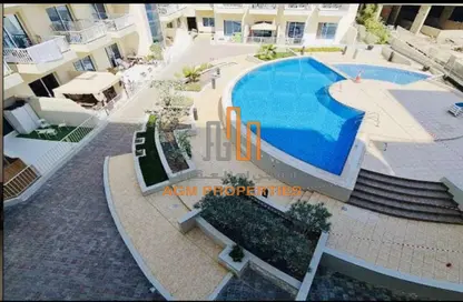 Pool image for: Apartment - 1 Bathroom for rent in Knightsbridge Court - Jumeirah Village Circle - Dubai, Image 1