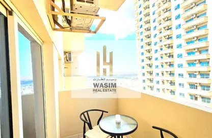 Apartment - 1 Bedroom - 2 Bathrooms for sale in Lilies Tower - Emirates City - Ajman