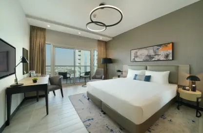 صورة لـ غرفة- غرفة النوم النزل و الشقق الفندقية - 1 حمام للايجار في داماك هيلز 2 - دبي ، صورة رقم 1