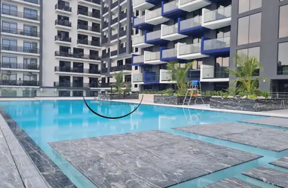 Pool image for: Apartment - 1 Bedroom - 2 Bathrooms for rent in Binghatti Crest - Jumeirah Village Circle - Dubai, Image 1