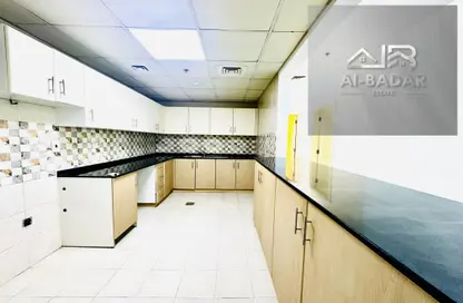Kitchen image for: Apartment - 1 Bedroom - 2 Bathrooms for rent in District 12 - Jumeirah Village Circle - Dubai, Image 1