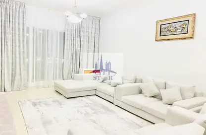 Living Room image for: Apartment - 2 Bedrooms - 2 Bathrooms for sale in Magnolia 2 - Emirates Gardens 2 - Jumeirah Village Circle - Dubai, Image 1