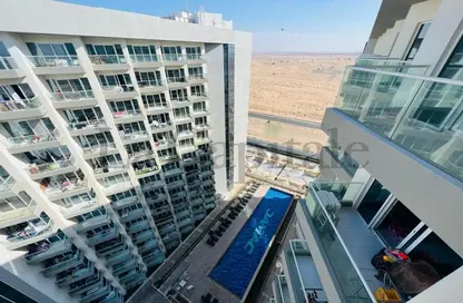 Outdoor Building image for: Apartment - 1 Bedroom - 2 Bathrooms for rent in Viridis C - Viridis Residence and Hotel Apartments - Damac Hills 2 - Dubai, Image 1