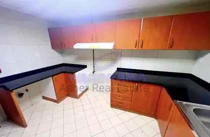 Kitchen image for: Apartment - 2 Bedrooms - 3 Bathrooms for rent in Al Murjan Tower - Al Majaz 2 - Al Majaz - Sharjah, Image 1