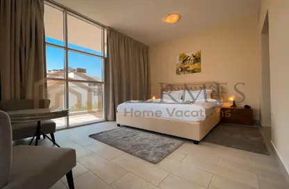 Room / Bedroom image for: Apartment - 1 Bedroom - 2 Bathrooms for rent in Chaimaa Premiere - Jumeirah Village Circle - Dubai, Image 1