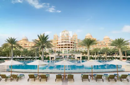 Pool image for: Apartment - 1 Bedroom - 1 Bathroom for sale in Raffles The Palm - The Crescent - Palm Jumeirah - Dubai, Image 1