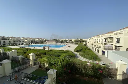 Outdoor Building image for: Townhouse - 3 Bedrooms - 3 Bathrooms for rent in Bayti Townhouses - Al Hamra Village - Ras Al Khaimah, Image 1