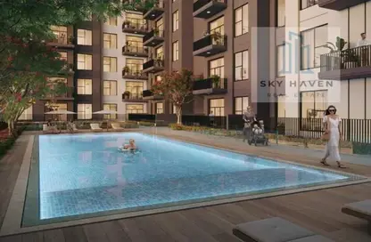 Pool image for: Apartment - 2 Bedrooms - 3 Bathrooms for sale in Grove - Town Square - Dubai, Image 1