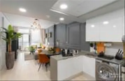 صورة لـ مطبخ شقة - غرفة نوم - 1 حمام للايجار في بلوم تاورز ايه - ابراج بلووم - قرية الجميرا سركل - دبي ، صورة رقم 1