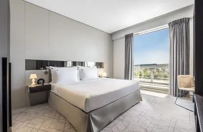 صورة لـ غرفة- غرفة النوم النزل و الشقق الفندقية - غرفة نوم - 2 حمامات للايجار في المنطقة الحرة بمطار دبي (DAFZA) - دبي ، صورة رقم 1