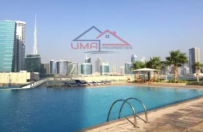 صورة لـ حوض سباحة شقة - 2 غرف نوم - 3 حمامات للبيع في برج تشرشل السكني - أبراج تشرشل - الخليج التجاري - دبي ، صورة رقم 1