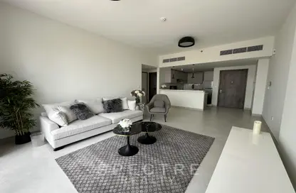 Living Room image for: Apartment - 1 Bedroom - 2 Bathrooms for sale in 1 Residences - 2 - Wasl1 - Al Kifaf - Dubai, Image 1